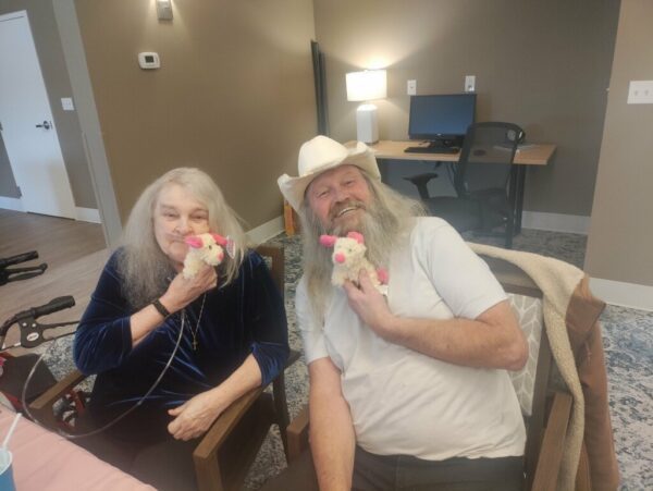 centralia point residents holding stuffed animals and smiling 